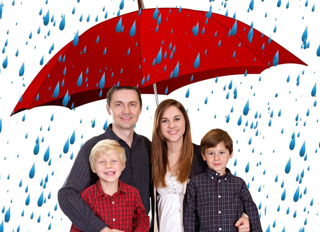 family under an umbrella